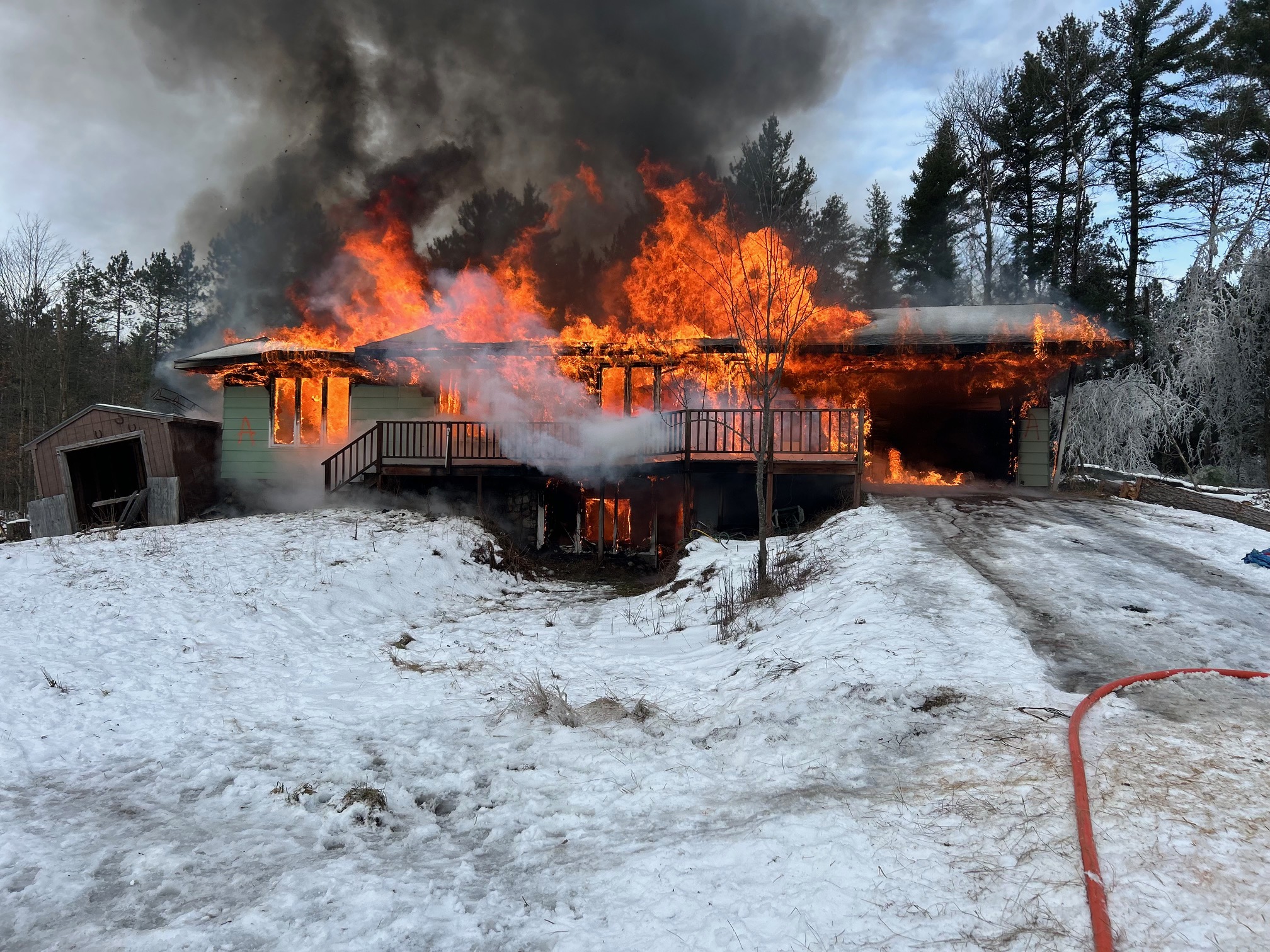 A controlled-burn training house used for firefighter practice